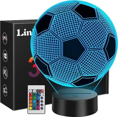A 3D soccer ball night light with a remote control and its packaging.