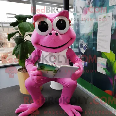 Obrázek produktu pro Postava REDBROKOLY maskota růžové žáby oblečená s kalhotami a brýlemi na čtení