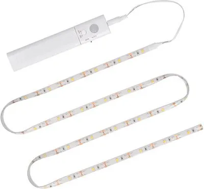 A white LED light strip with a motion sensor module attached to one end, laid out in a serpentine pattern on a white background.