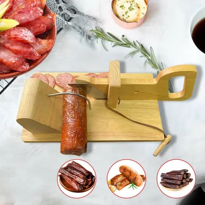 A wooden slicer for sausage or cheese, with sliced sausage and other meat products in the foreground and background.