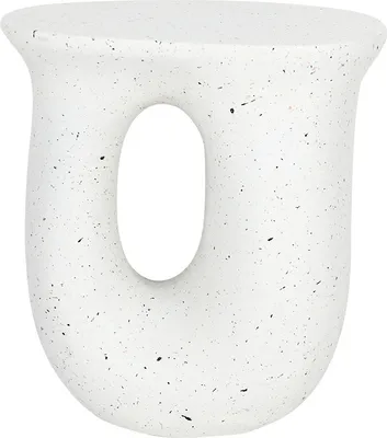 A white speckled side table with a U-shaped opening.