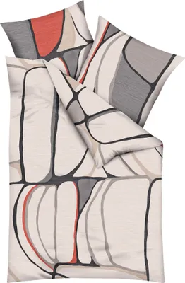 A folded duvet cover and pillowcase with a graphic abstract pattern.