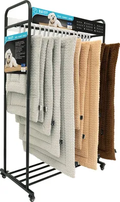 A display rack with multiple pet blankets of varying sizes and colors.