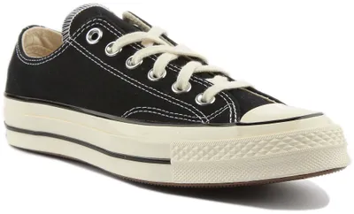 A studio shot of a black Converse Chuck 70 sneaker with a platform sole.