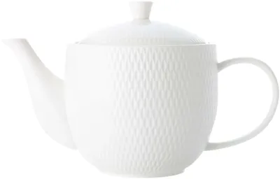 A white porcelain teapot with a textured diamond pattern, shown against a white background.