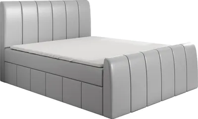 A modern, upholstered boxspring bed with a headboard and footboard, shown from a side angle on a white background.