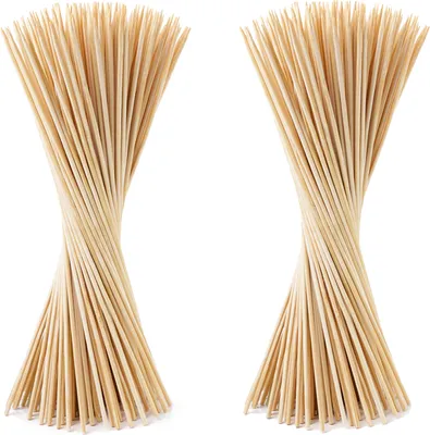 Two bunches of bamboo stakes are shown against a white background.