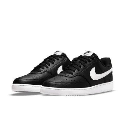 A pair of black Nike Court Vision Lo Nn sneakers with white accents, presented on a white background.