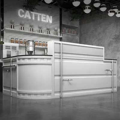 A modern bar counter with a metallic finish, set against a concrete wall and floor.
