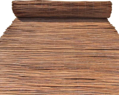 A rolled-up mat made of natural materials, likely for outdoor use.