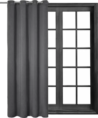 A dark gray curtain is partially covering a window with multiple panes.