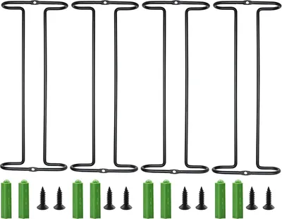 Four black metal wine glass holders are arranged in a row against a white background. Below the holders are green wall plugs and black screws.