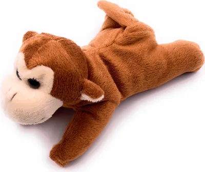 A plush toy monkey lying on its back against a white background.