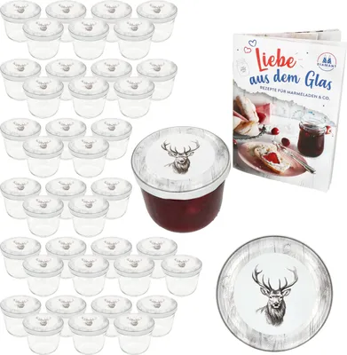 A set of glass jars with lids, a jar of jam, and a recipe book.