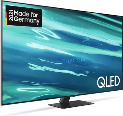 A Samsung QLED TV is displayed on a stand with a blue abstract background.