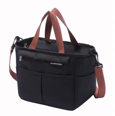 A black insulated lunch bag with brown straps is shown against a white background.
