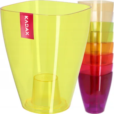A stack of colorful plastic plant pots, with a single yellow pot in the foreground.