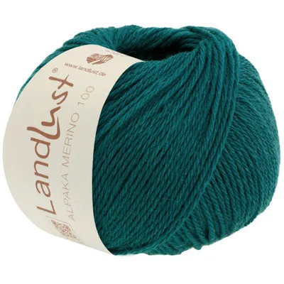 A ball of teal yarn with a label wrapped around it.