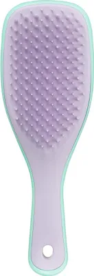 A hairbrush with mint green and lilac colors against a white background.