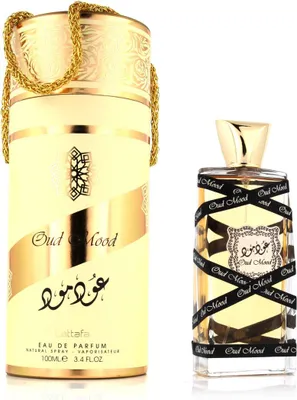 A perfume bottle and its packaging are displayed against a white background.