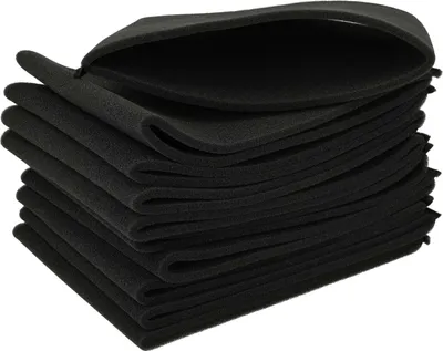 A stack of black, folded foam pads.