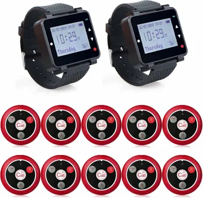 A set of restaurant pagers, including two watch receivers and multiple call buttons, arranged on a white background.