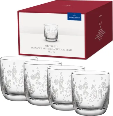 A set of four shot glasses with a festive design, presented in their original packaging.