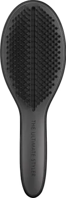 A black hairbrush is shown against a white background.