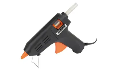 A black and orange hot glue gun is shown against a white background.