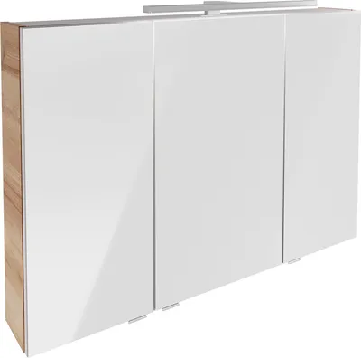 A three-door bathroom cabinet with a wood-effect side and a white, reflective front, featuring a light fixture above.