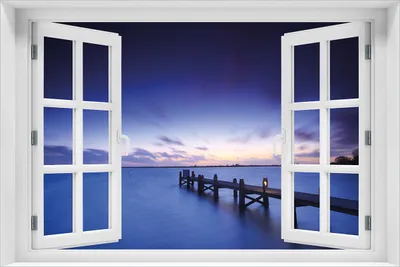 Produktbild von Wallario Poster mit Fenster-Illusion: Steg bei Abenddämmerung - Blauer Himmel bei Nacht, Größe: 61 x 91,5 cm (Maxiposter)