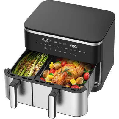 A dual-chamber air fryer with food inside both chambers, displayed on a white background.