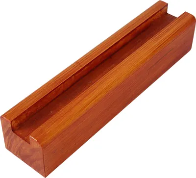A wooden Scrabble tile rack on a white background.