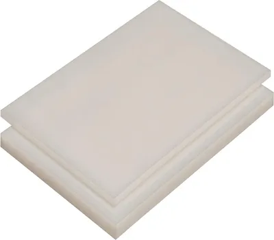 Two white plastic sheets stacked on a white background.