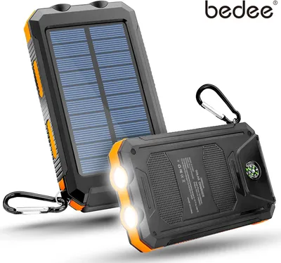 A solar power bank with two lights and a compass is shown, with a second solar panel device behind it.