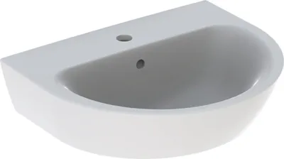 A white ceramic sink with a curved basin and a flat top surface with holes for a faucet and drain.
