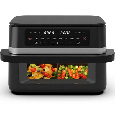A black and silver air fryer with a digital display and two compartments containing food.