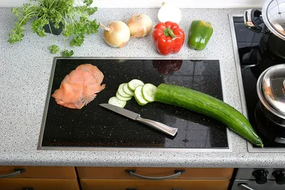 A kitchen counter with ingredients being prepared for cooking.