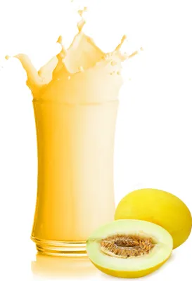 A glass of yellow liquid with a splash, next to a whole and a halved honeydew melon.