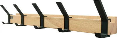 A wooden coat rack with five black hooks against a white background.