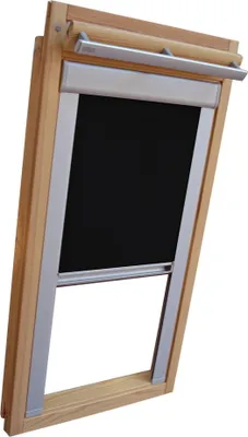 A close-up view of a black roller blind with silver side rails, installed in a wooden frame of a skylight window.