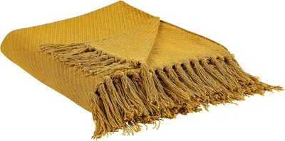 A mustard yellow throw blanket with fringe is shown diagonally against a white background.
