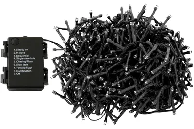 A black battery pack with function labels and a tangled pile of black LED string lights.