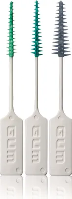 Three interdental brushes are arranged vertically against a white background.