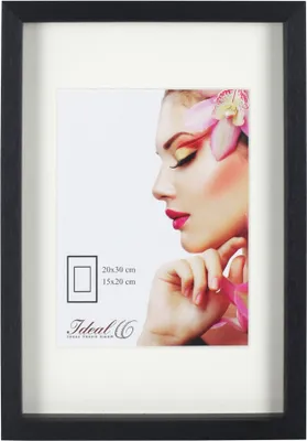 A framed picture of a woman's face with a flower in her hair.