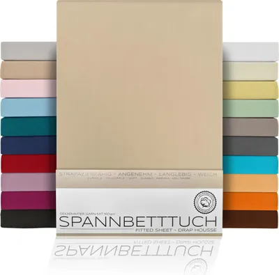 A stack of folded fitted sheets in various colors, with a beige sheet prominently displayed in the center.