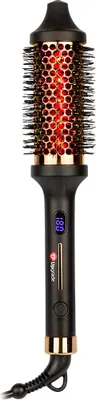A black and gold thermal hair brush with a red glowing barrel, shown against a white background.