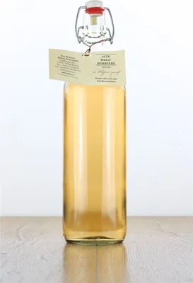 A clear studio shot of a bottle of Prinz Alte Wald-Himbeere liqueur.