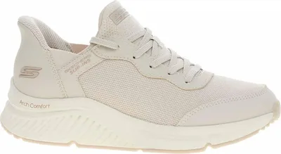 A side view of a beige Skechers slip-on sneaker.