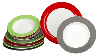 A stack of colorful plates and two individual plates.